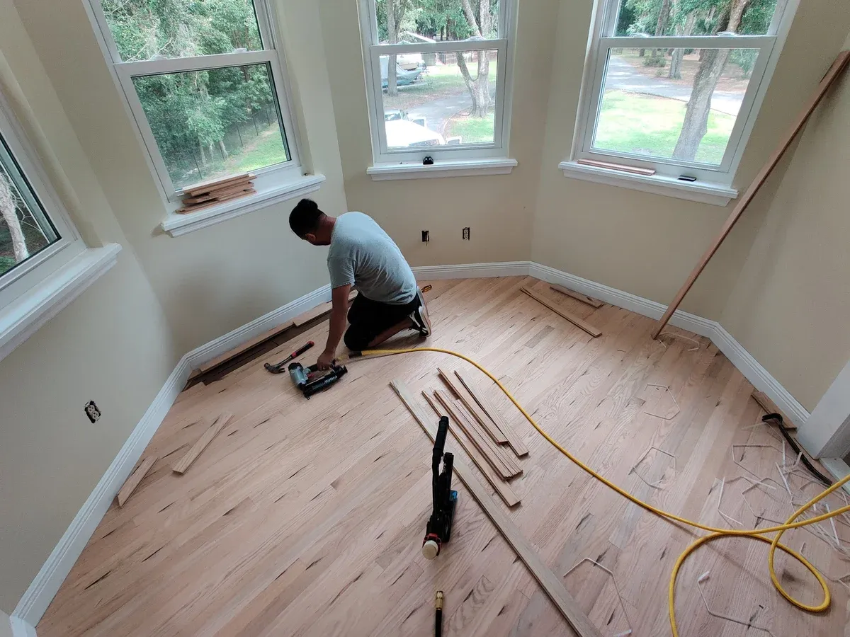 Hardwood floor installation in progress — nail-down oak flooring by 3 Floor Guys in Orlando FL